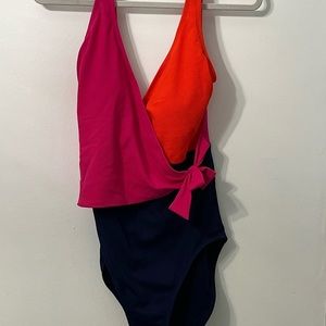 Tommy Bahama side tie one piece. Fits true to size.